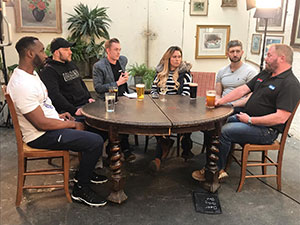 Skilled plumbing workers around a table