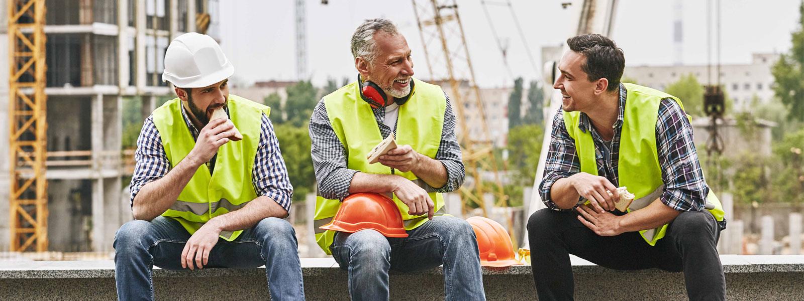 Happy tradespeople eating sandwiches Happy tradespeople eating sandwiches