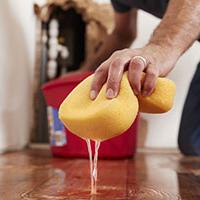 A man cleaning up a plumbing disaster and thinking about water claims A man cleaning up a plumbing disaster and thinking about water claims