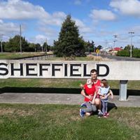 Last years winner of the PolyMax prize next to a Sheffield sign