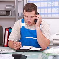 Plumber filling out a self assessment form Plumber filling out a self assessment form