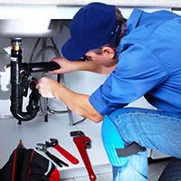 self-employed plumber plumbing in a sink self-employed plumber plumbing in a sink