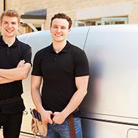 Plumbers by their work van