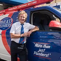 Pimlico owner stood next to plumbing van