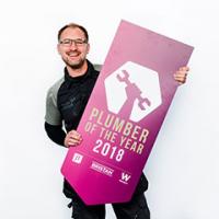 Steve Bartin holding Plumber Of The Year sign Steve Bartin holding Plumber Of The Year sign