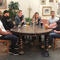 Skilled plumbing workers around a table Skilled plumbing workers around a table